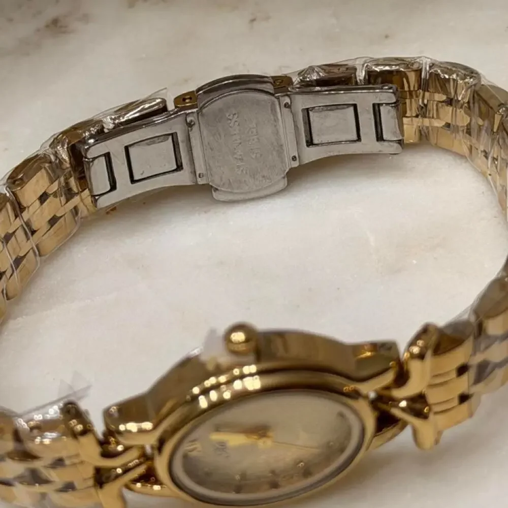 Gold watch with white face